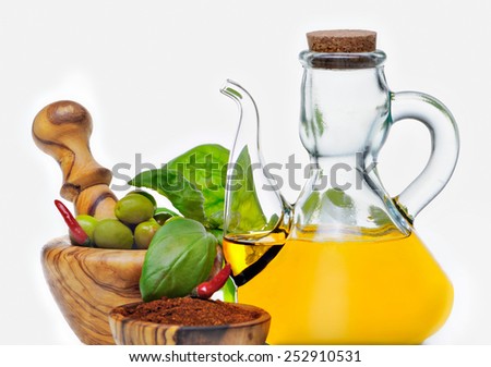 olive oil and olives with spices and other ingredients, isolated on white background