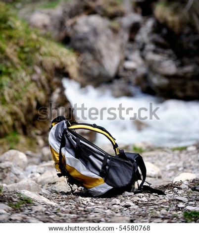 Backpack - Camping trip background in the alp mountains.