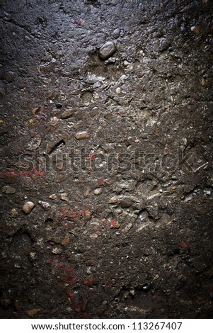 A view of wet wall from little stones. Details of concret