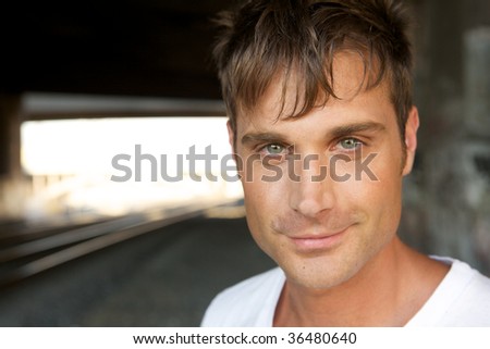An Attractive Young Man with a Smirk at the Camera