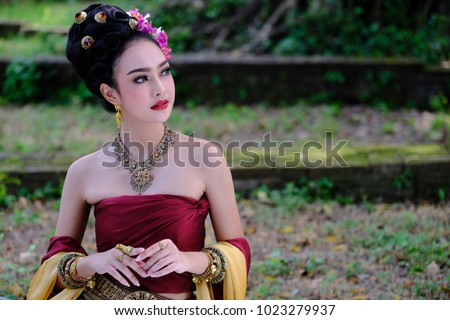 https://image.shutterstock.com/display_pic_with_logo/3670022/1023279937/stock-photo-beautiful-thai-girl-in-traditional-dress-costume-in-choeng-tha-as-thai-temple-where-is-the-public-1023279937.jpg