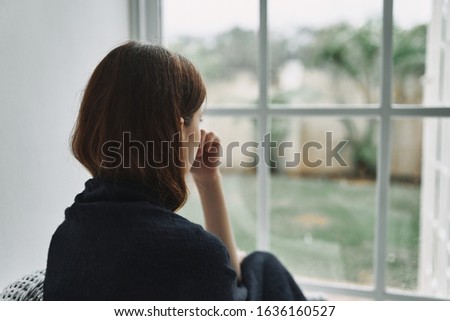 Similar – Image, Stock Photo Woman behind window in building near trees