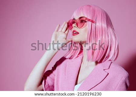 Young positive woman bright makeup pink hair glamor stylish glasses color background unaltered Stockfoto © 