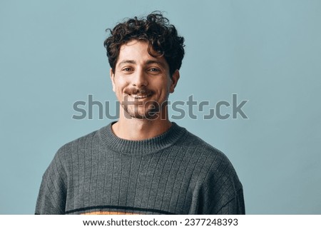 Similar – Image, Stock Photo A man smiling friendly into the camera sits at home at the table next to a colourful bouquet of flowers