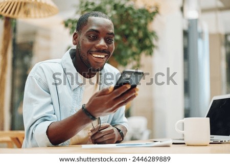 Similar – Image, Stock Photo Cheerful black man using smartphone in cafe