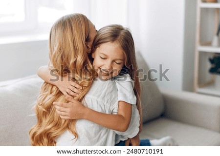 Similar – Image, Stock Photo Child hugging mother Love