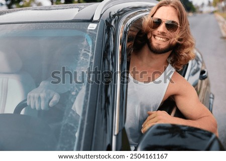 Similar – Image, Stock Photo Adventurer leaning on the door of an off-road car