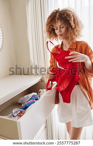 Similar – Image, Stock Photo Appealing female in swimsuit posturing on beach