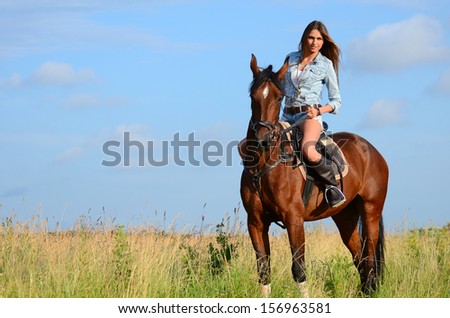 The woman on a horse in field