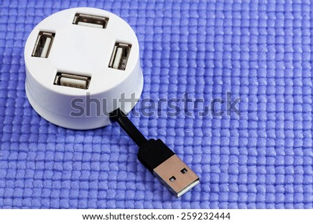 Round Multiple Port Powered USB Hub on blue background