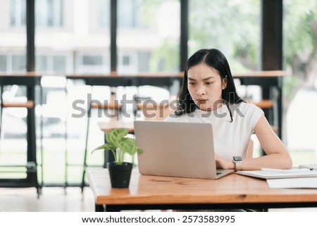 Similar – Image, Stock Photo Young woman with intense green eyes looks at camera