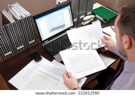 Business working - manager works in the office until late hours with documents,\
office work,