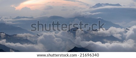 Misty evening of hilly area. Northern Caucasia, Russia. Horizontal panorama.