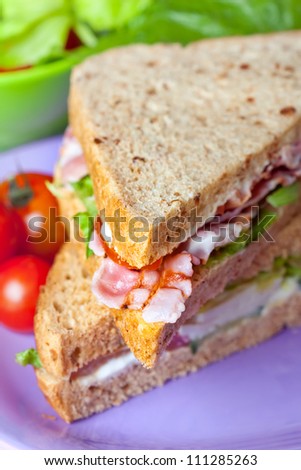 Sandwiches with bacon, lettuce and tomato with malted bread, close-up shot, shallow dof