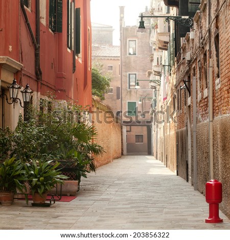 View of a typical narrow Venice street, square composition
