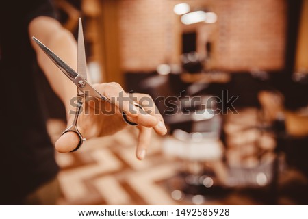 Similar – Image, Stock Photo Hands of a barber washing the head with shampoo to a client with the head resting on the sink