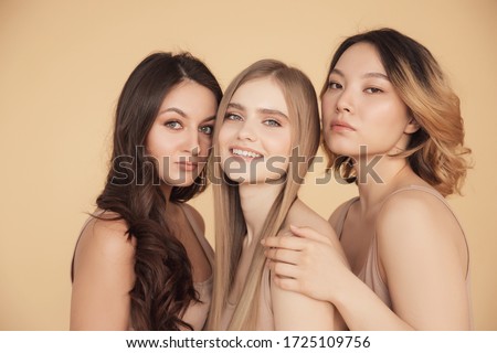 Similar – Image, Stock Photo Young blonde asian woman in knitted turtleneck sweater with fairy lights and bokeh around