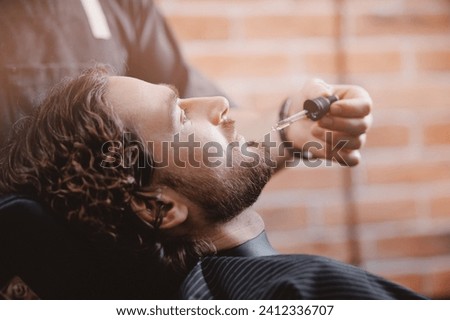 Similar – Image, Stock Photo Bearded man applying makeup on eyes