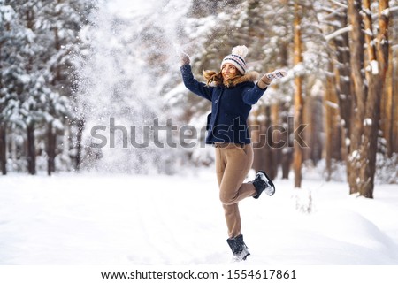 Similar – Image, Stock Photo Woman throwing snow in snowy landscape in winter.