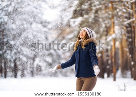 Similar – Image, Stock Photo Woman throwing snow in snowy landscape in winter.