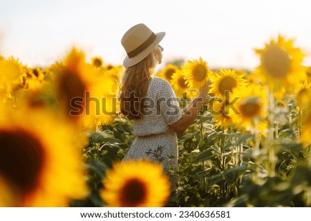 Similar – Foto Bild chica sujetando girasoles en el balcon