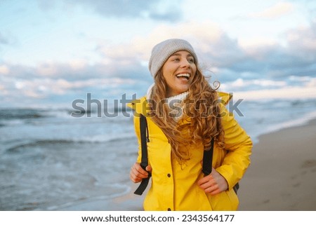 Similar – Image, Stock Photo Woman on the North Sea beach. Lots of sky, water and sand. Memories.