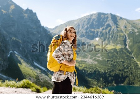 Similar – Image, Stock Photo Traveling woman with backpack near pond in woods