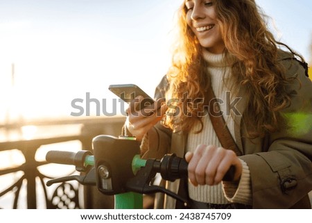 Similar – Image, Stock Photo Activating electric scooter from smartphone