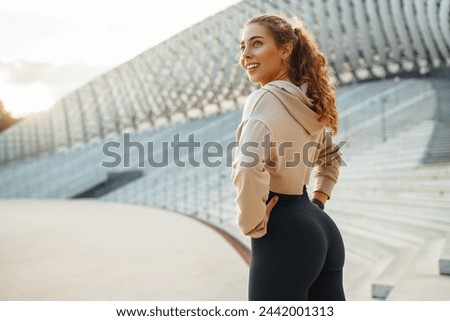 Similar – Image, Stock Photo Fit female athlete doing bound angle pose