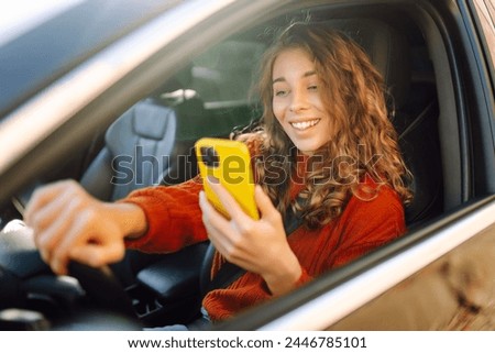 Similar – Foto Bild Junge schöne Frau fährt ein Auto. Reise-Konzept. Blick von innen. Weg der Bäume Straße