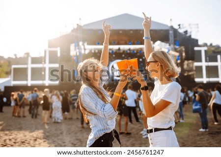 Similar – Image, Stock Photo Young woman drinking beer in a beach bar