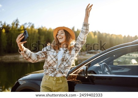 Similar – Image, Stock Photo Thoughtful young female tourist standing on rocky seashore and looking away