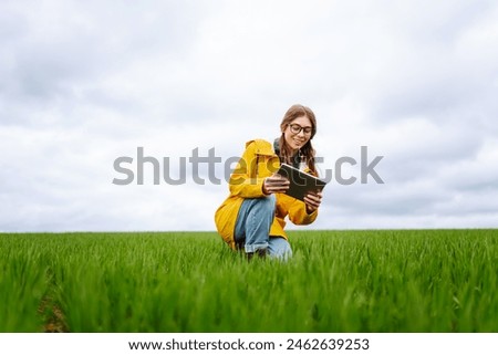 Image, Stock Photo Crop woman with ripe eggplants