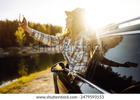 Similar – Image, Stock Photo Thoughtful young female tourist standing on rocky seashore and looking away