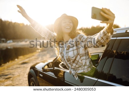 Similar – Image, Stock Photo Thoughtful young female tourist standing on rocky seashore and looking away