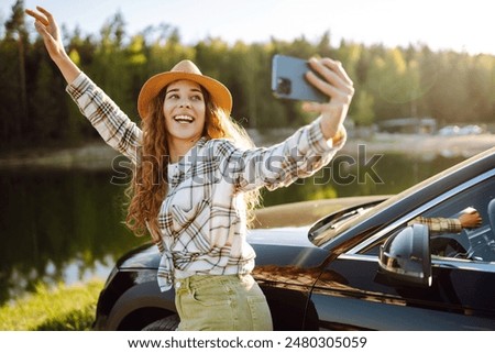 Similar – Image, Stock Photo Thoughtful young female tourist standing on rocky seashore and looking away