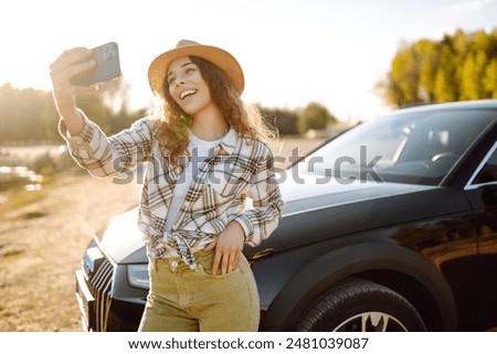 Similar – Image, Stock Photo Thoughtful young female tourist standing on rocky seashore and looking away