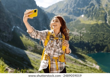 Similar – Foto Bild Junge Frau fotografiert Berge mit der Kamera