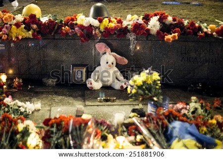 Kiev, Ukraine - 22 February 2014: Flowers and toys the funeral ceremony at Independence Square for anti-government protesters who were killed during protests in downtown Kiev