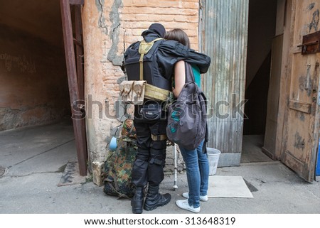 Kyiv, Ukraine - 03.06.2014:A girl says goodbye to a volunteer from the Social National Assembly, before they were sent to the eastern part of Ukraine to join the ranks of battalion \