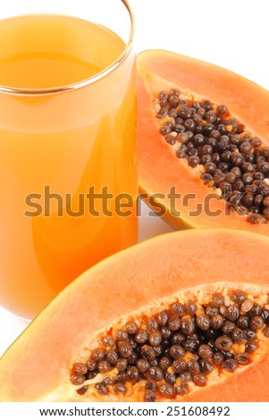 papaya fruit and glass of juice isolated on white