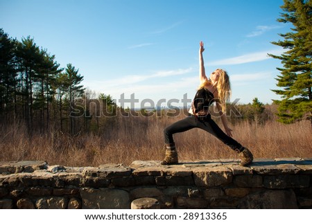 Young woman practicing yoga on a spring afternoon.