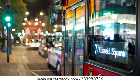 abstract view of bus and traffic in London with street lights at night with bokeh effect