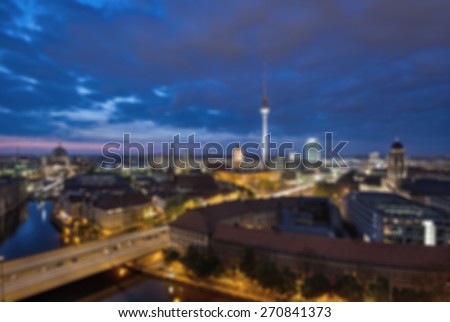 abstract blurred background of Berlin with TV Tower at evening, Germany