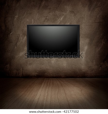 flat tv on a wall in a dark room