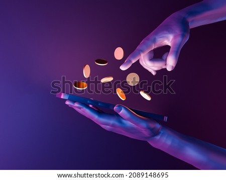 3d hands holding a cell phone with coins on the screen. neon lights. futuristic concept of play to earn, video games, technology, metaverse and crypto. 3d rendering