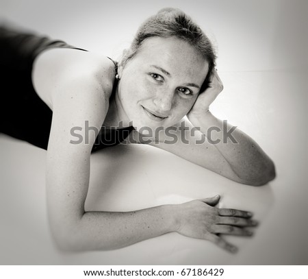 Young happy woman in sport wear. Black and white
