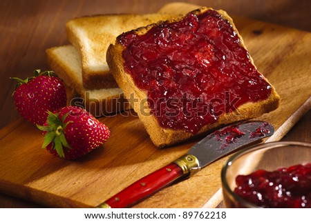 toast snack with cherry jam and strawberry