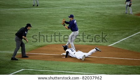 TORONTO - MAY 19: Tampa Bay Rays\' player Evan Longoria at third base in a MLB game against the Toronto Blue Jays at Rogers Centre on May 19, 2011 in Toronto.  The Blue Jays won 3-2.