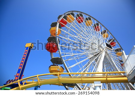SANTA MONICA, CALIFORNIA - JULY 1: Pacific Park on the Santa Monica pier on July 1, 2012 in Santa Monica, California. The park opened on 1996 and has the world\'s only solar powered Ferris wheel.
